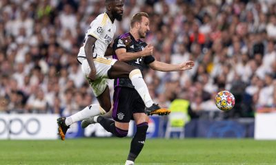 Harry Kane jäi Antonio Rüdigerin (vas.) ja muun Real-puolustuksen puristukseen Madridissa.